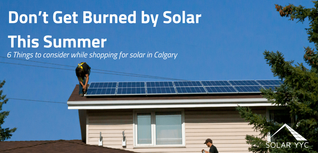two men installing solar panels on a roof on a cloudless sunny day. Text reads, "Don't Get Burned By Solar This Summer"